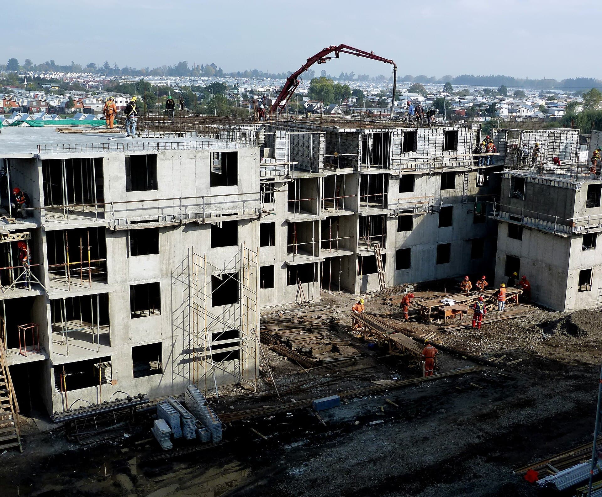 Multi-storey residential buildings under concrete construction.