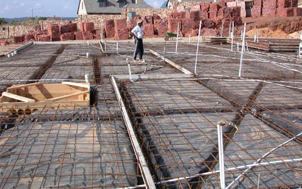 A residential concrete slab in place on a prepared site