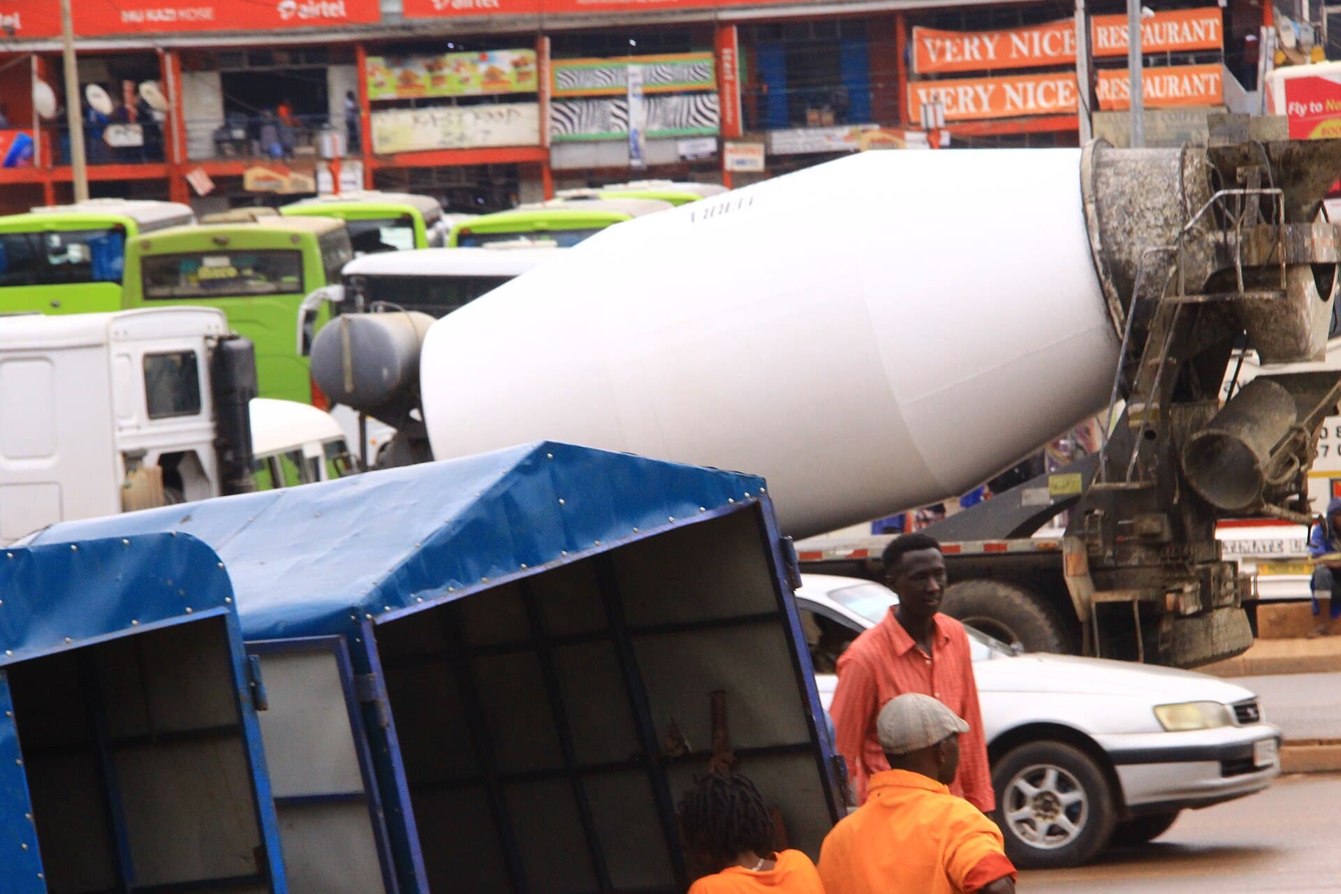 A ready-mix concrete mixer truck parked on a street